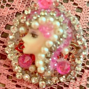 Jeweled face brooch